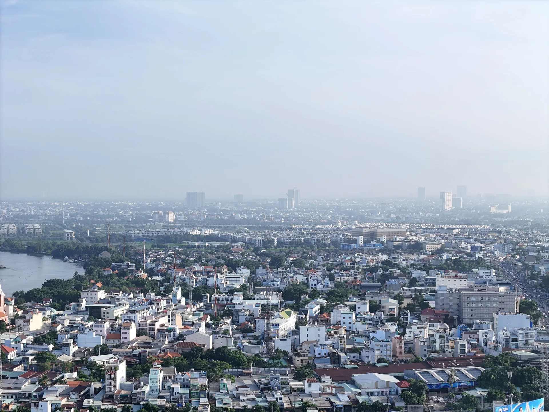 Urban neighbourhoods and a river in Ho Chi Minh City seen from above