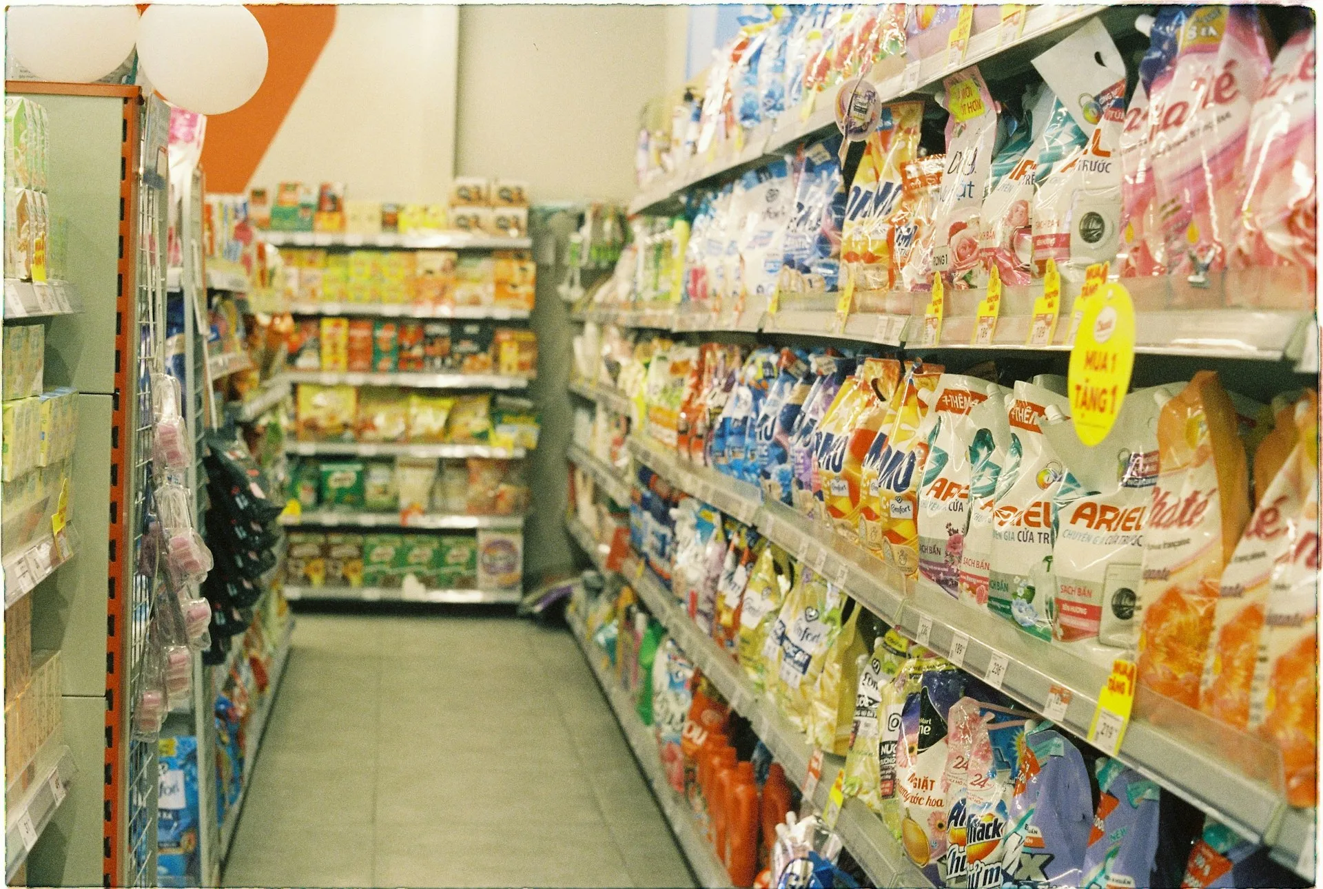 Vietnam supermarket shelves with groceries and household products