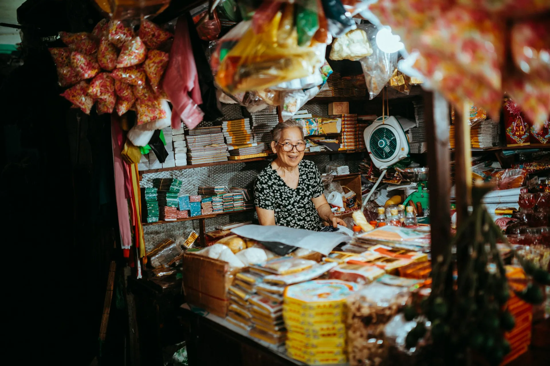 Shopkeeper in a small Vietnamese market stall